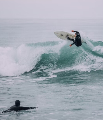 Surfer ripping a wave at Kaikoura, New Zealand