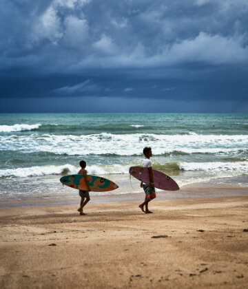 Surfers at Kamala beach, Phuket, Thailand