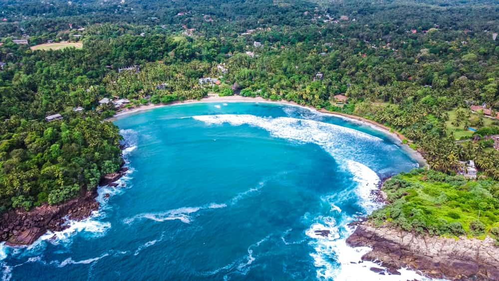 Drone picture of surfing in Sri Lanka at Hiriketiya Beach