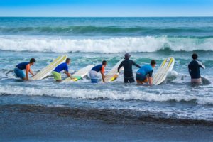 Group-of-people-preparing-to-surf-with-instructors in surf camps in Costa Rica