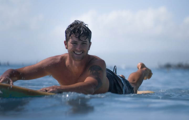 A happy surfer in the ocean 