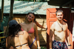 Group of surfers in the shower after a surf session