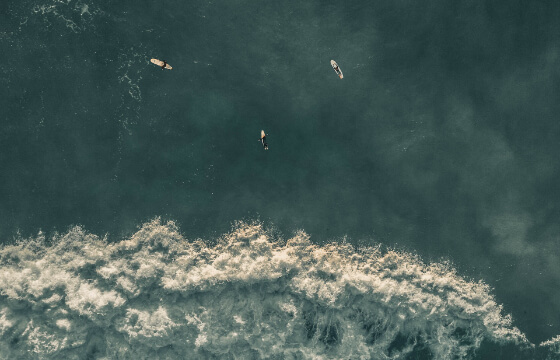 Drone view of surfers in Cancún, Mexico