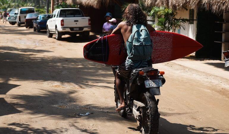 Surfer on a motorbike 