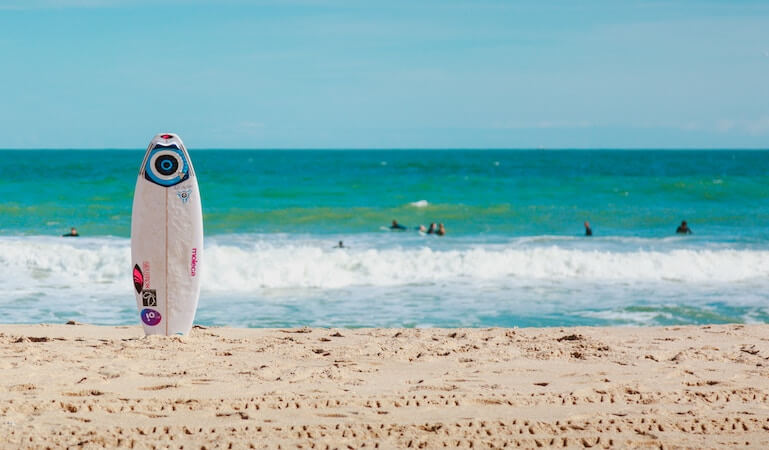 a short-board on a beach