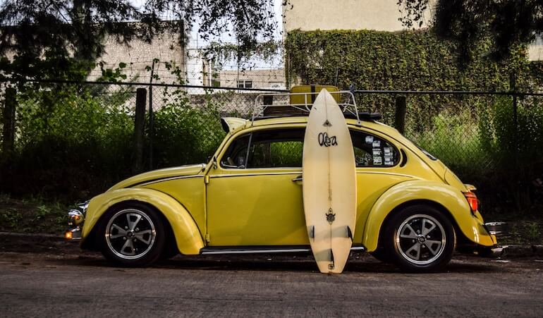 A shortboard and a car 