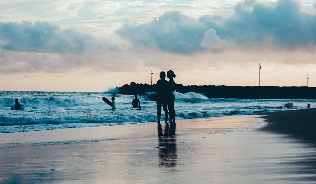 family enjoying in he beach