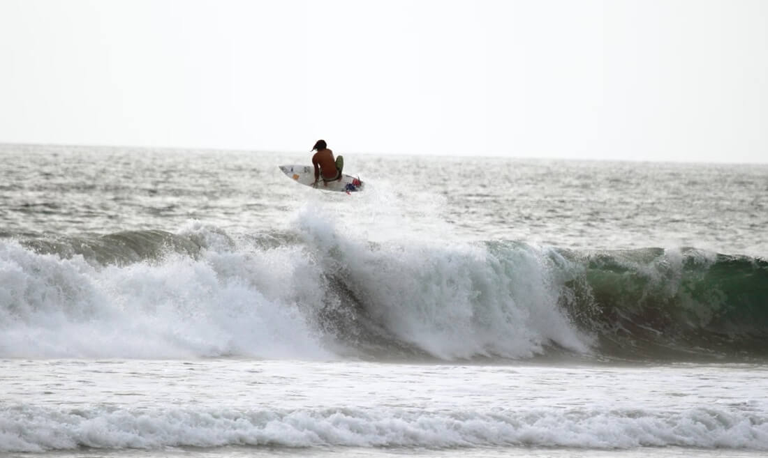 man performing stunts while on surfboard