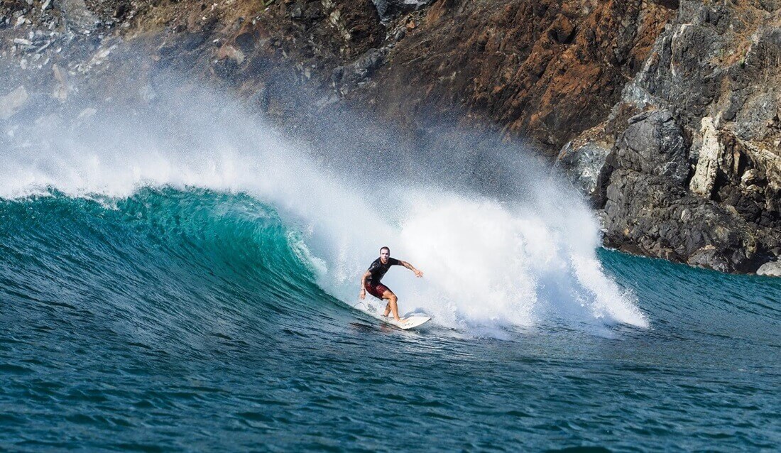 man surfing high waves