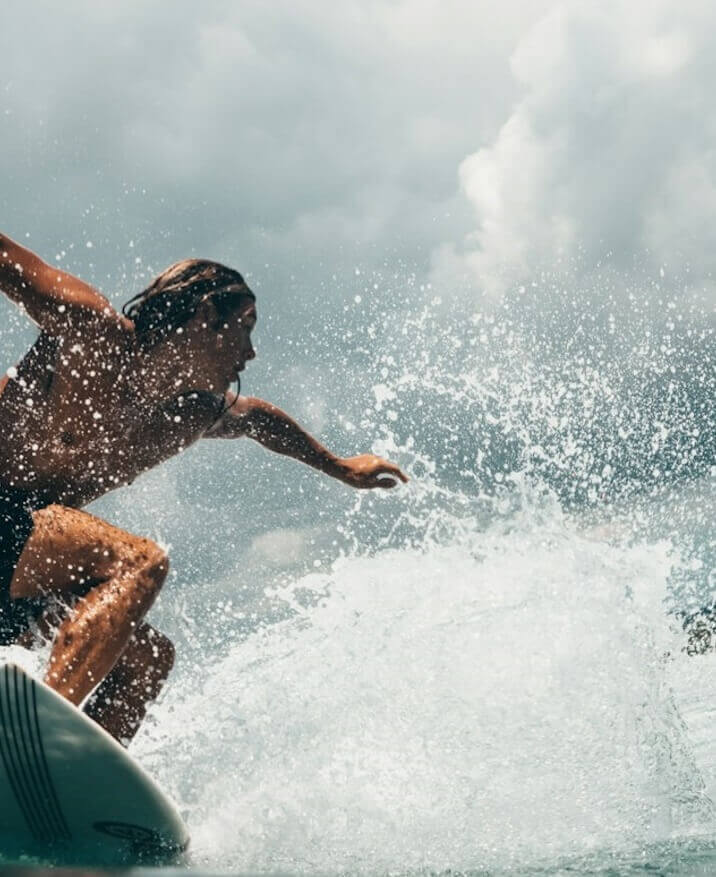 Man surfing waves in Indonesia