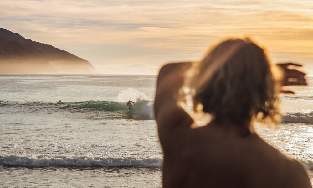 Surfers riding the waves