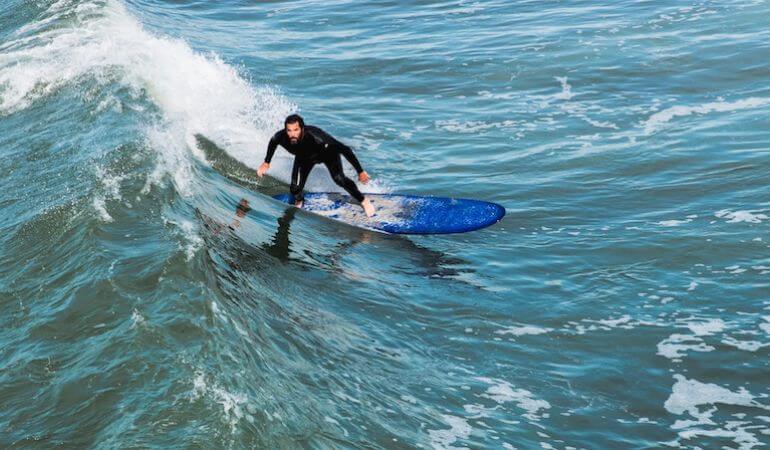 A surfer catching a wave