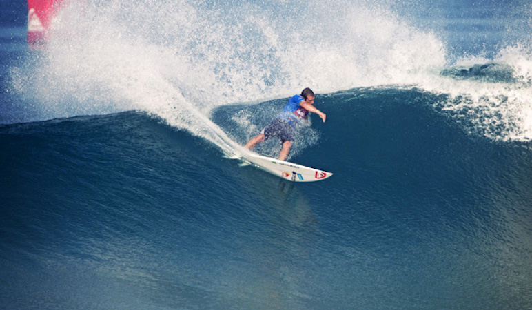 A surfer doing a cutback 