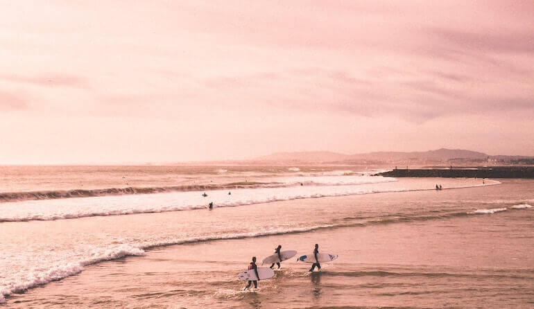 A bunch of surfers enjoying the waves in the Philippines 