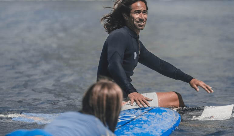 Surf instructor with students 