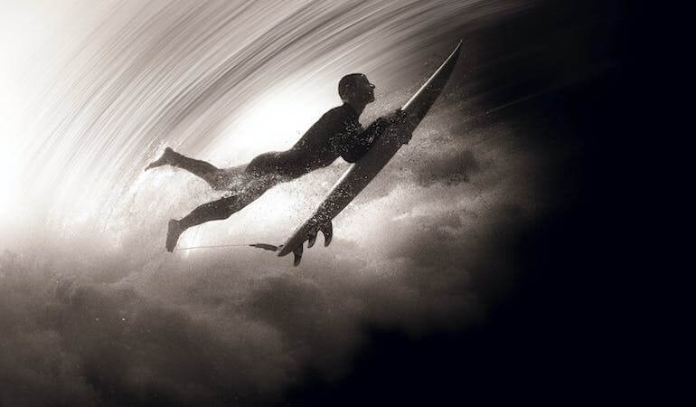 Surfer doing a duck dive 