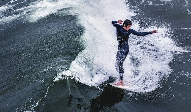 Surfer turning on a wave