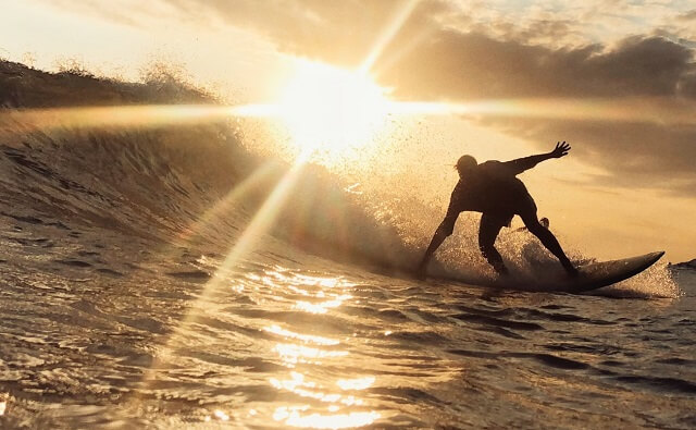 Surfer during a sunset session in Canggu, Bali