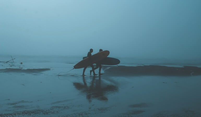 Surfers at dawn patrol 